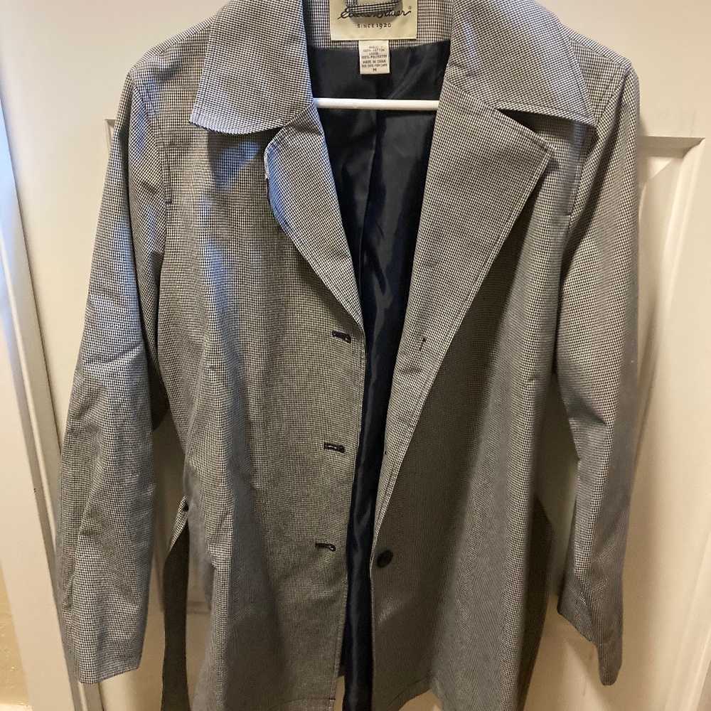 Knee length women’s blazer with belt.